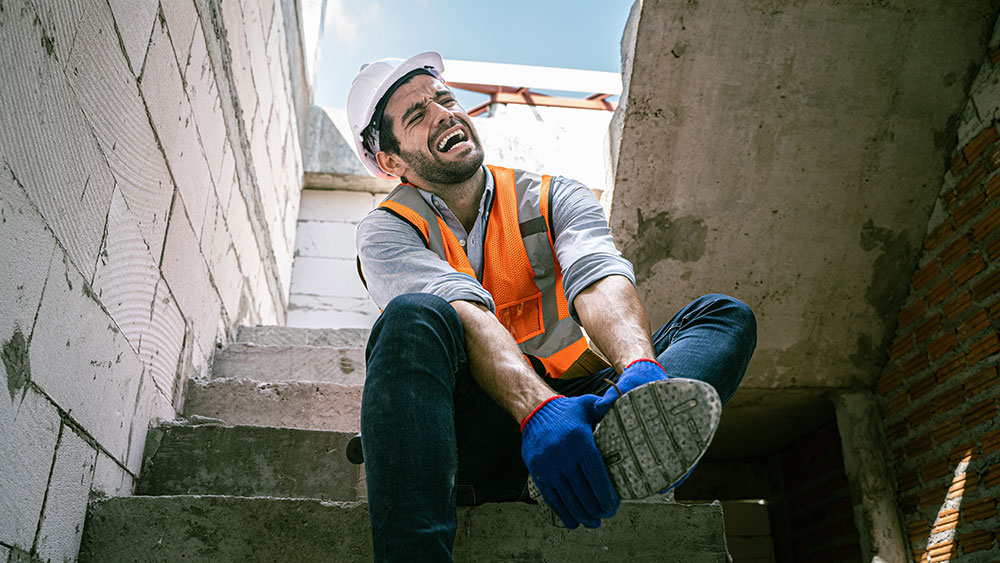 Construction Accident man with hurt leg